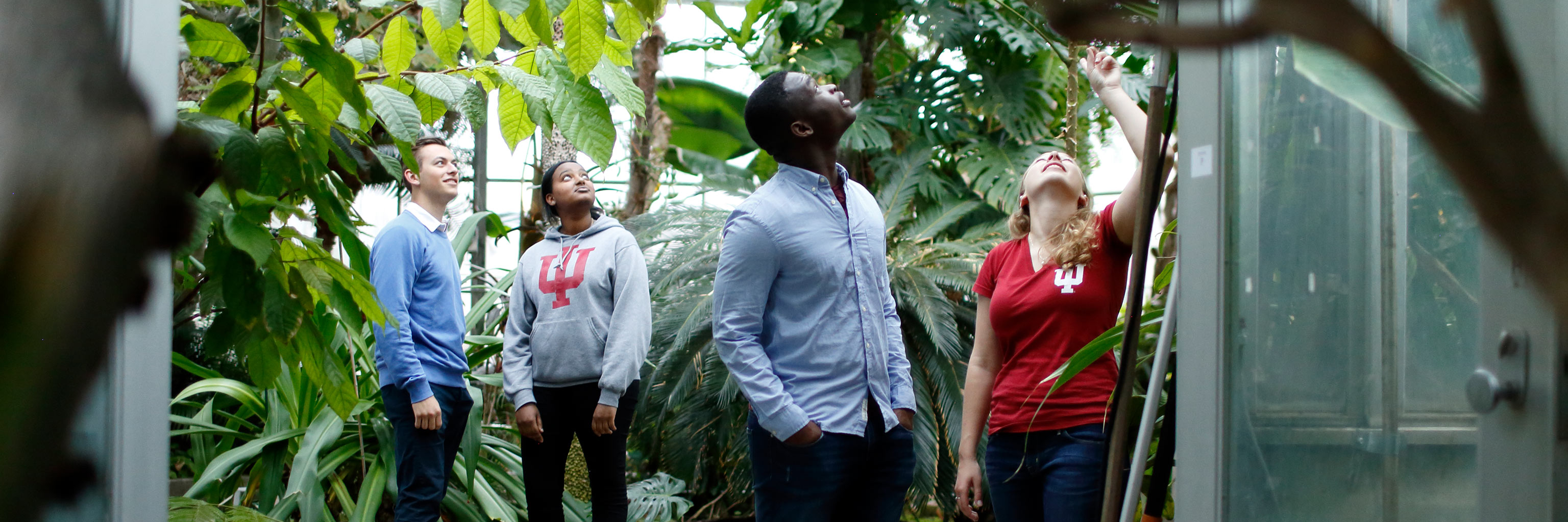 students touring greenhouse