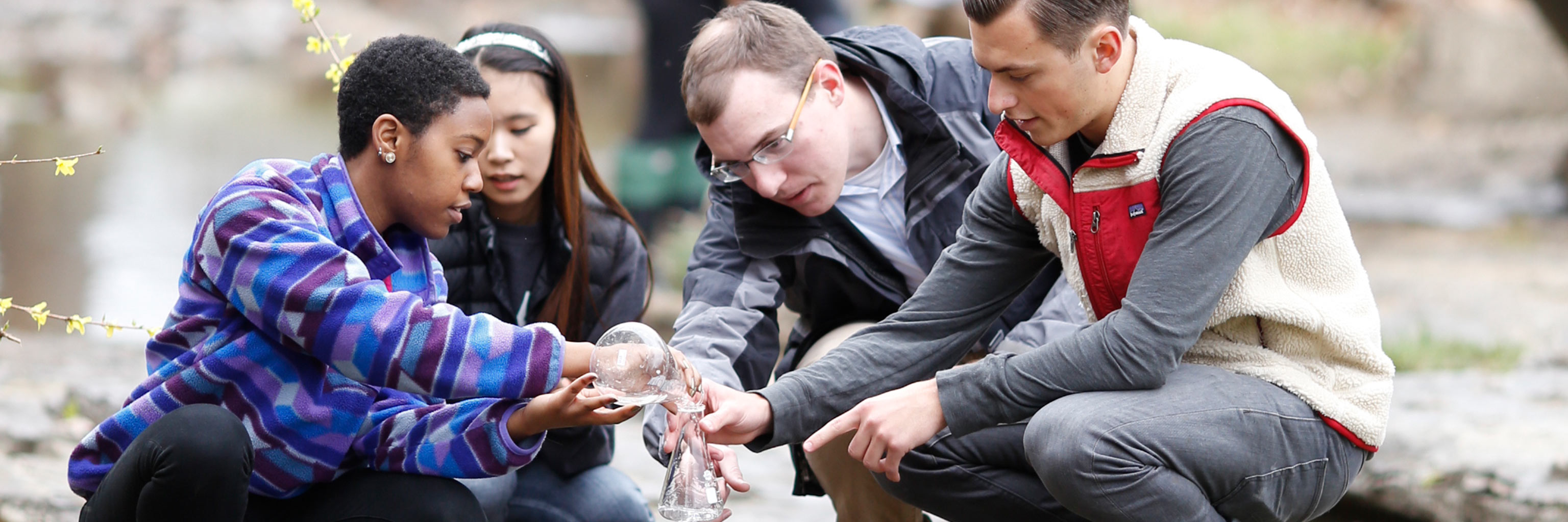 students gathering water for class