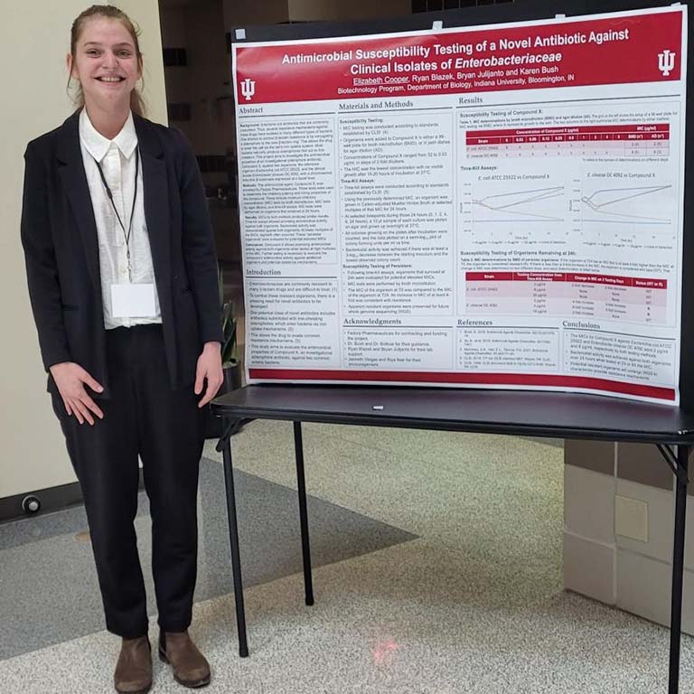 Elizabeth Cooper presents her STEM/Hutton Honors College poster in April 2023.