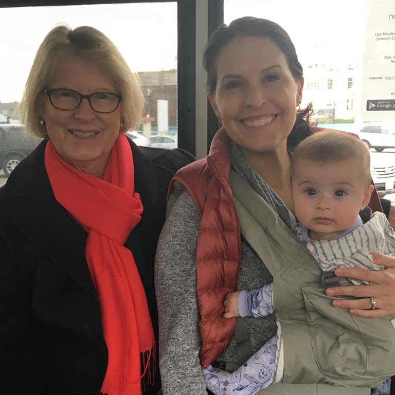 Rosvall's mother, Kim Rosvall, and Rosvall's baby daughter on their way to a conference. Rosvall's parents accompanied her to help care for the baby.