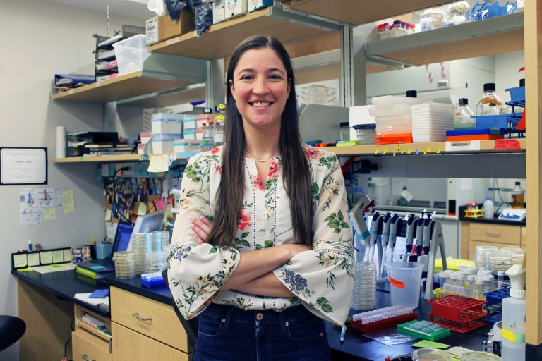 Jennifer Chlebek poses at her lab bench.