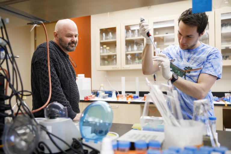 Dan Tracey and Jeremy Davis working in the lab.