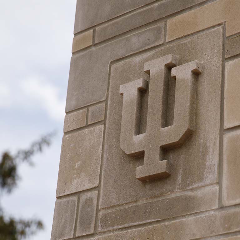 IU trident engraved in stone pillar.