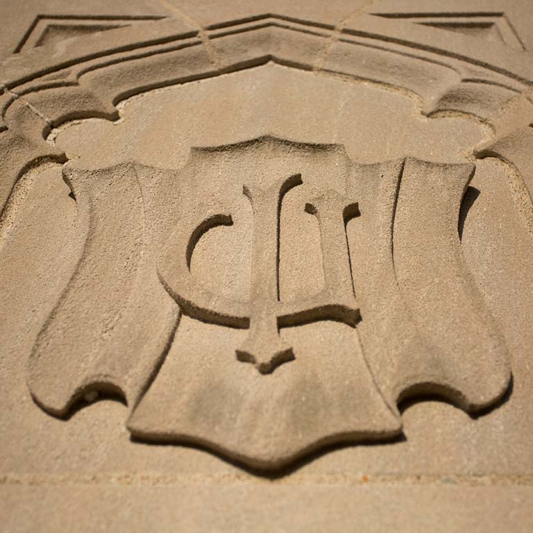 IU logo engraved in limestone.